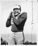 Player Adjusting Helmet by North Carolina Agricultural and Technical State University