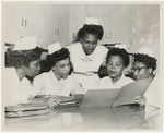 Nursing students review a file
